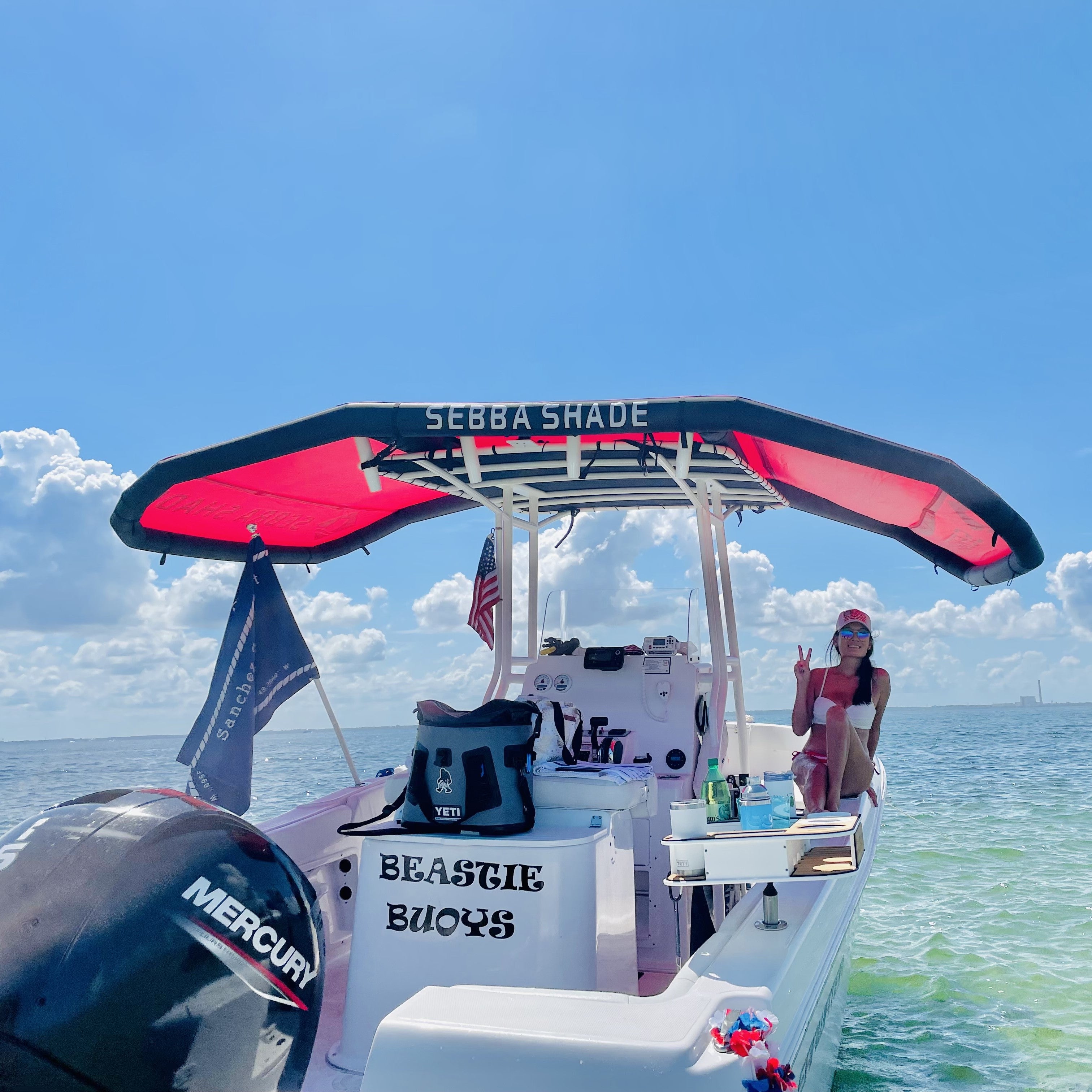 Girl with peace sign under Sebba Shade